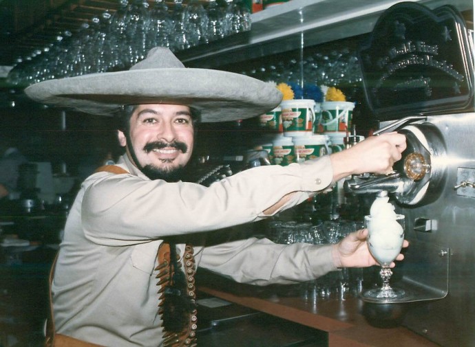 Mariano pulling from the Original Frozen Margarita Machine in Bandido Outfit